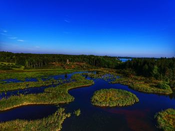 Scenic view of landscape against clear blue sky