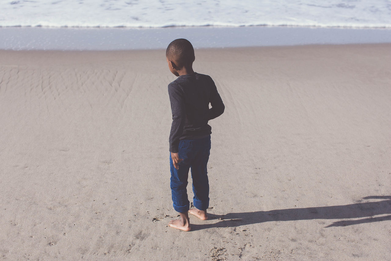 beach, sand, full length, shore, lifestyles, casual clothing, leisure activity, vacations, nature, tranquility, portrait, tranquil scene, day, outdoors, sky, beauty in nature, scenics, remote, coastline