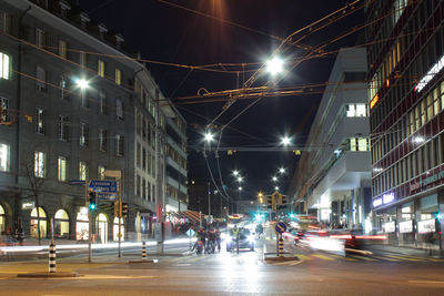 Illuminated city street at night