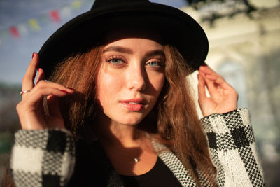 Portrait of a young woman in a hat