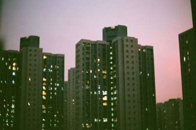 Modern buildings in city at night