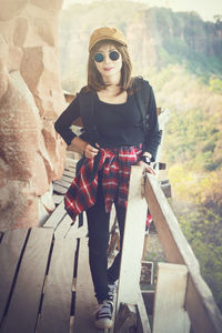 Portrait of young woman standing outdoors