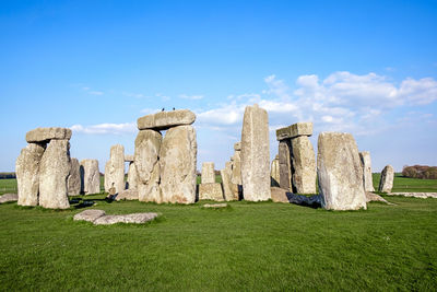 View of natural landmark on field against sky