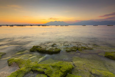 Scenic view of sea against sky during sunset