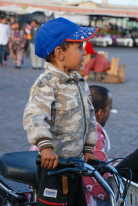 Full length of a boy sitting in bus