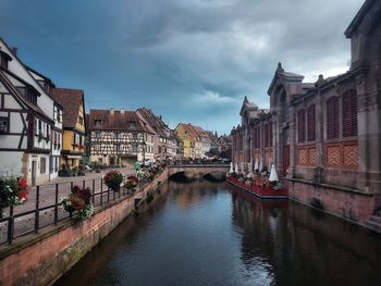 Canal amidst buildings in city