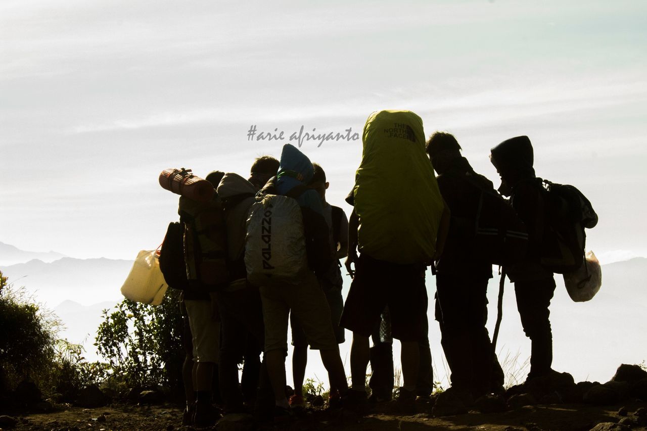 men, togetherness, lifestyles, sky, leisure activity, person, standing, silhouette, rear view, bonding, friendship, travel, tourism, outdoors, love, travel destinations