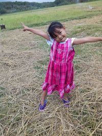 Full length of girl on field