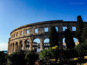 Low angle view of historical building against clear sky