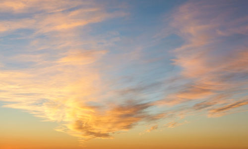 Low angle view of dramatic sky during sunset