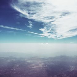 Aerial view of calm sea against cloudy sky