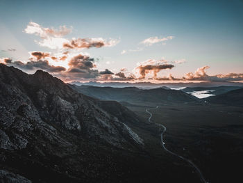 Scenic view of rocky mountains against sky during sunset