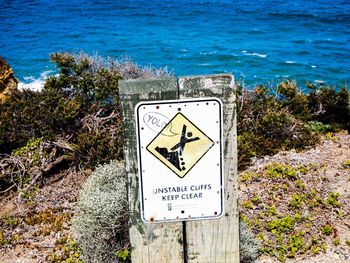 Information sign against blue sky