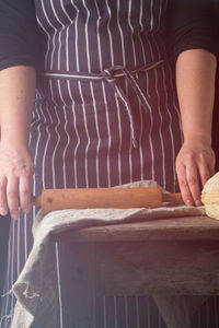 Midsection of woman preparing food