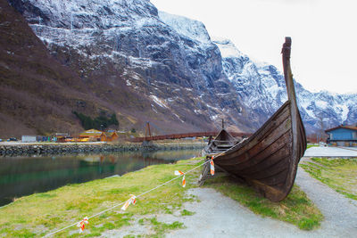 Scenic view of lake against mountain during winter