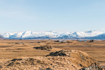 Scenic view of snowcapped mountains against sky