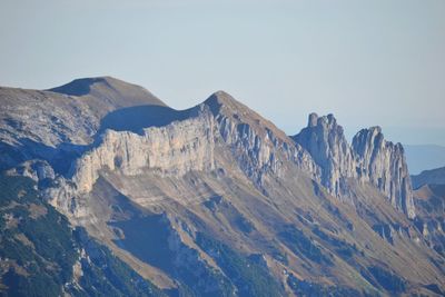 Scenic view of snowcapped mountains against clear sky