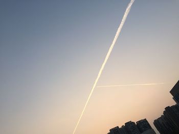 Low angle view of vapor trail against clear sky