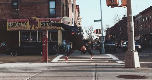 Woman standing on city street