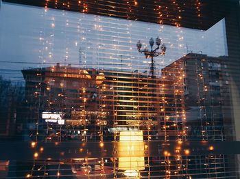 Reflections on window at night