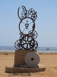 Close-up of lifeguard hut on beach against clear sky