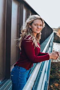 Portrait of young woman standing outdoors