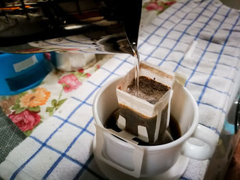 High angle view of coffee cup on table