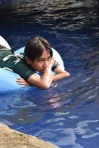 Teenager swimming in the pool