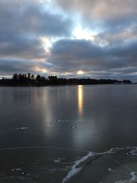 Scenic view of sea against cloudy sky