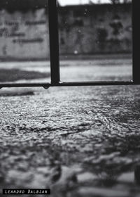 Reflection of building in puddle