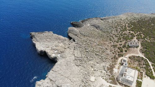 High angle view of rocks by sea