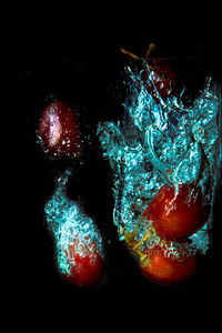 Close-up of fruits in black background