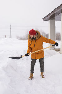 Full length of boy standing on snow