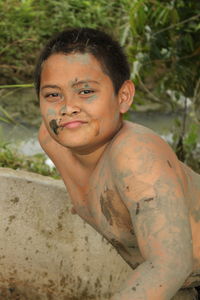 Portrait of messy shirtless boy