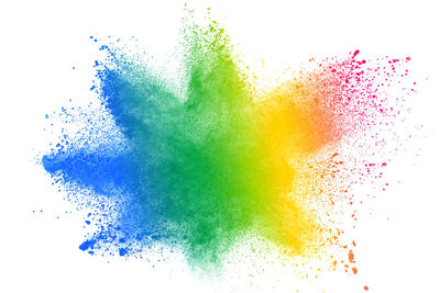 Abstract image of multi colored splashing water against white background