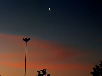 Low angle view of silhouette street light against sky during sunset