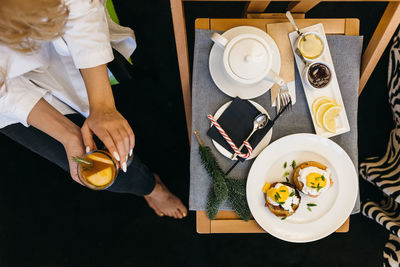 Flat lay photo of breakfast in the room, dinner in the room, tasty breakfast on a bed.