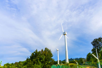 Low angle view of wind turbine against sky