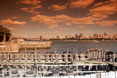 View of city buildings at sunset