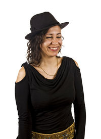 Portrait of young woman standing against white background