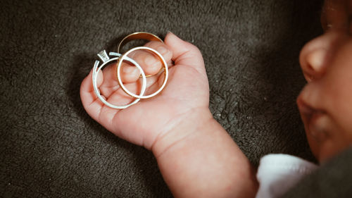 Close-up of hand holding ring