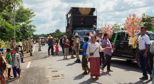 People on road against sky