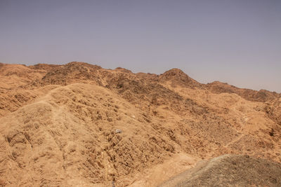 Scenic view of desert against clear sky