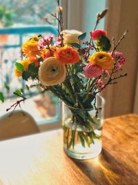 Close-up of roses in vase on table