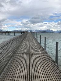 Pier over sea against sky