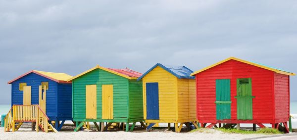 Beach huts against sky