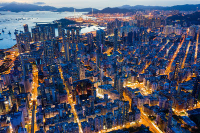 High angle view of city lit up at night