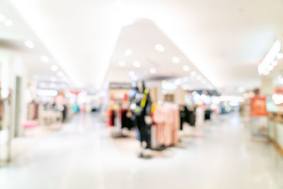 Blurred motion of illuminated lights at store