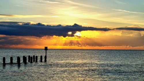 Scenic view of sea at sunset