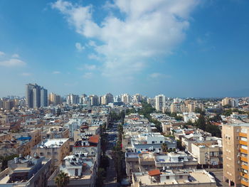 High angle view of buildings in city against sky